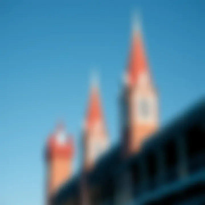 The iconic twin spires of Churchill Downs standing tall against a clear blue sky.